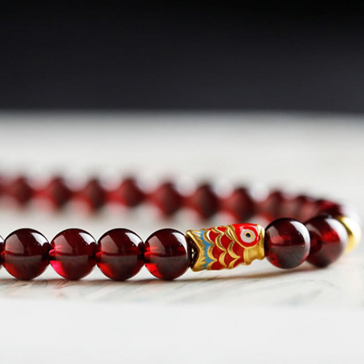 Pulsera de protección con granate natural y pez Koi de oro 999 de Buddha Stones - image 5