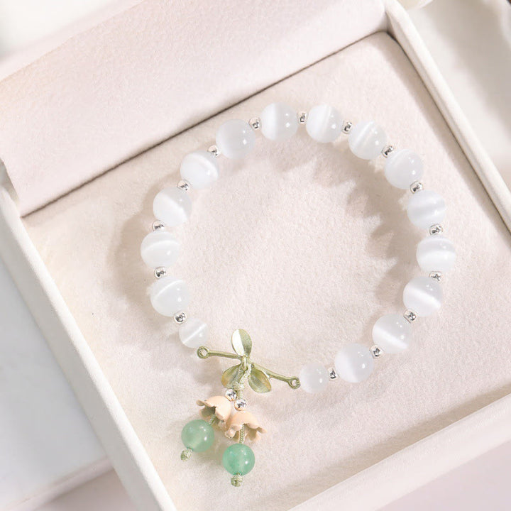 Pulsera con dije de orquídea de la paz, cristal rosa, calcedonia azul, aventurina verde, ojo de gato , Buddha Stones