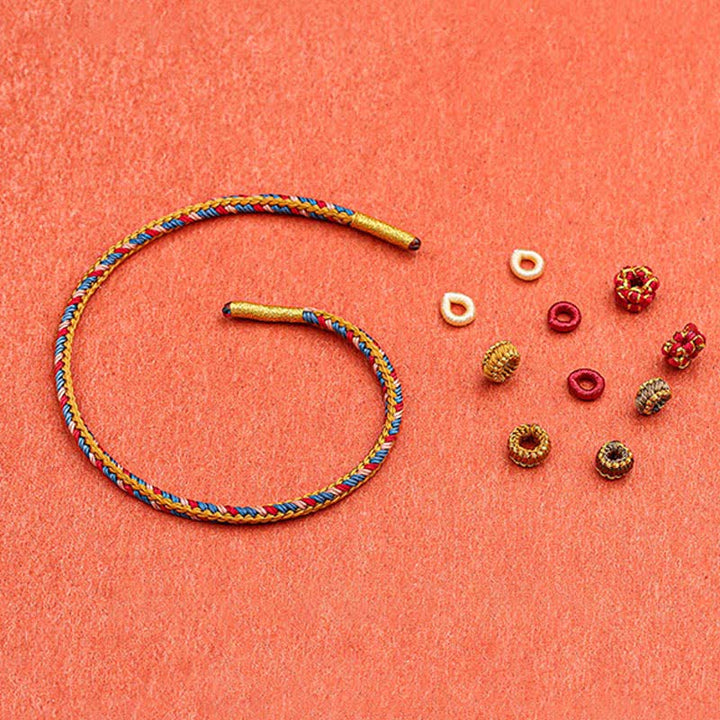 Pulsera de hilo trenzado de la suerte de color Dunhuang hecha a mano con Buddha Stones