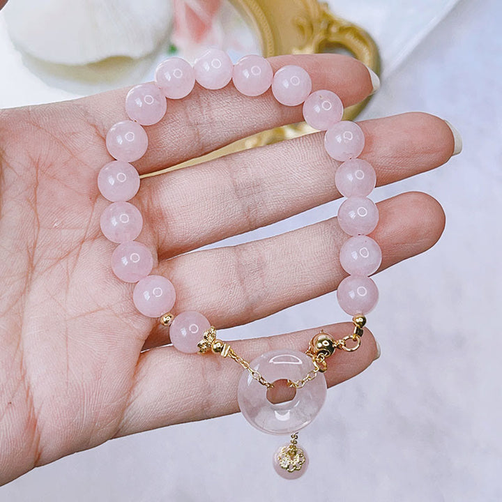 Pulsera con dije de amor con hebilla de paz y cristal rosa natural con Buddha Stones