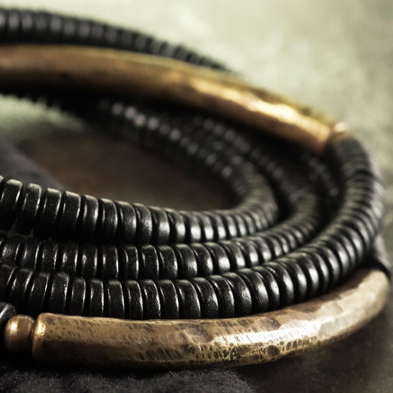 Pulsera multicapa con equilibrio de cobre y madera de ébano con Buddha Stones