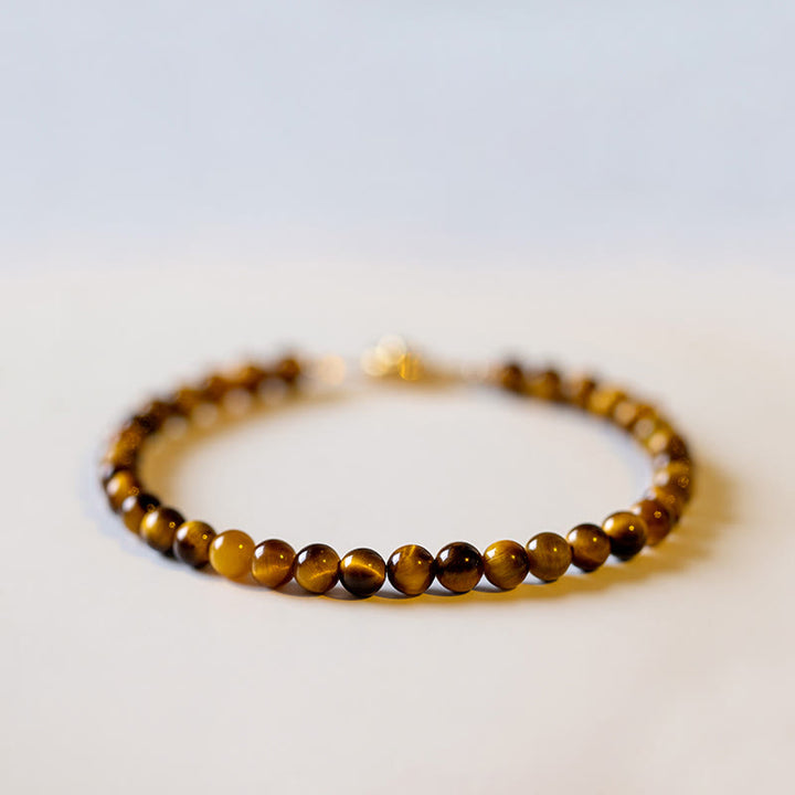 Buddha Stones Pulsera de protección de coraje con piedra de ojo de tigre natural chapada en oro de 14 quilates