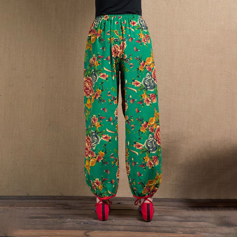 Pantalones bombachos con estampado de flores rojas y verdes de estilo étnico con Buddha Stones y bolsillos