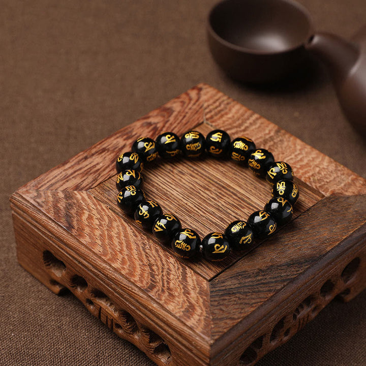 Pulsera de meditación Om Mani Padme Hum de ónix negro y cristal blanco del Tíbet con Buddha Stones