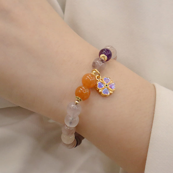 Pulsera de la riqueza del encanto del grano de la flor violeta del jade de la seda dorada púrpura natural de las Buddha Stones