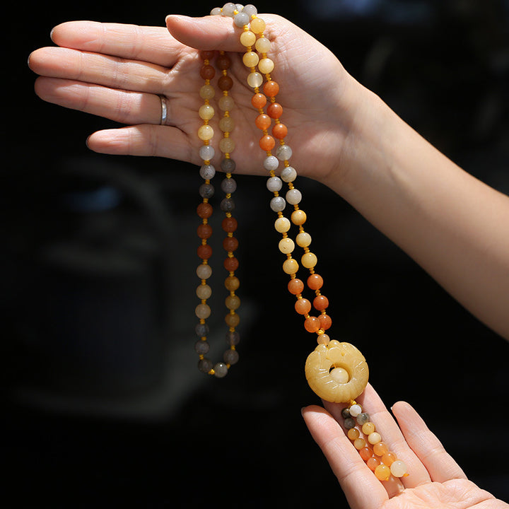 Collar con colgante de riqueza de jade de seda dorada tibetana con Buddha Stones