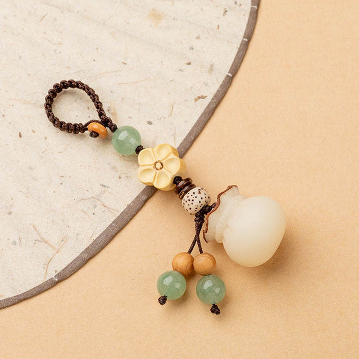 Llavero de prosperidad y bendición de flores, bolsa de dinero con semillas de Bodhi Natural, Buddha Stones