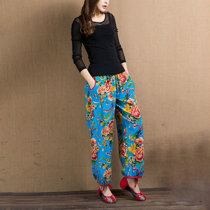 Pantalones bombachos con estampado de flores rojas y verdes de estilo étnico con Buddha Stones y bolsillos