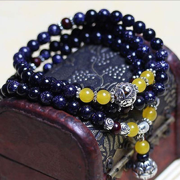 Pulsera con dijes de riqueza de piedra arenisca azul de piedras de Buddha Stones Mala