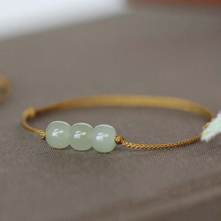 Pulsera de tejido de hilo de la suerte de jade con tres cuentas de piedras de Buddha Stones