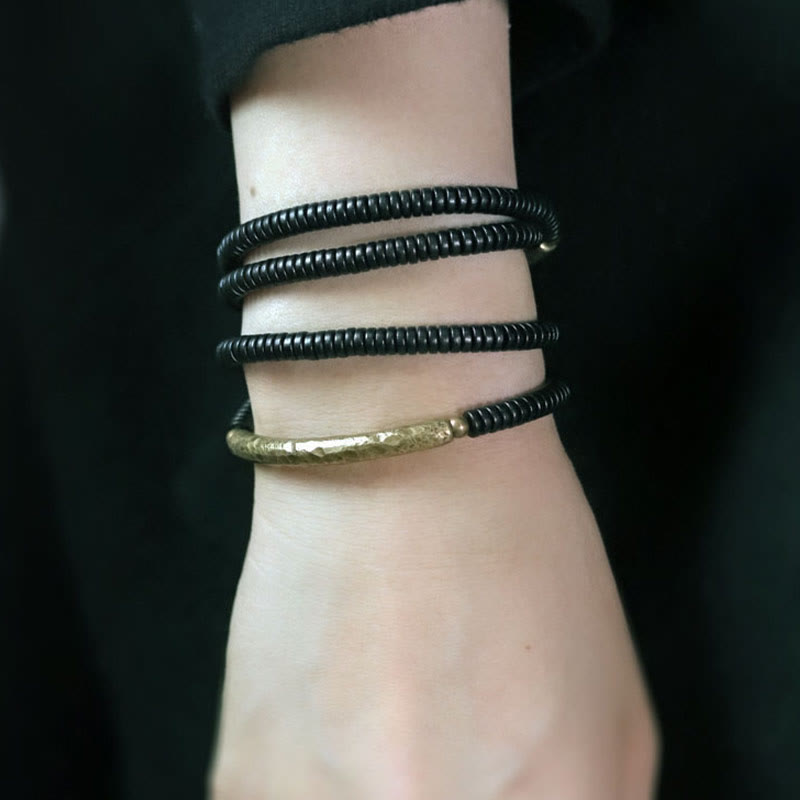 Pulsera multicapa con Buddha Stones, madera de ébano, latón y cobre - image 12