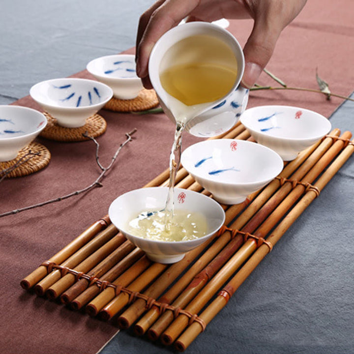 Buddha Stones Jingdezhen, porcelana azul y blanca, pez Koi, taza de té de cerámica, tazas de té de Kung Fu