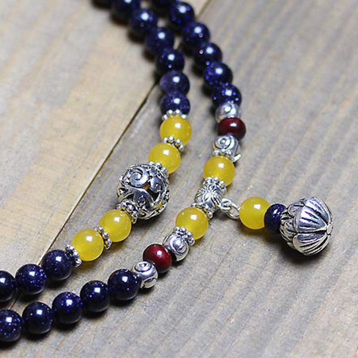 Pulsera con dijes de riqueza de piedra arenisca azul de piedras de Buddha Stones Mala