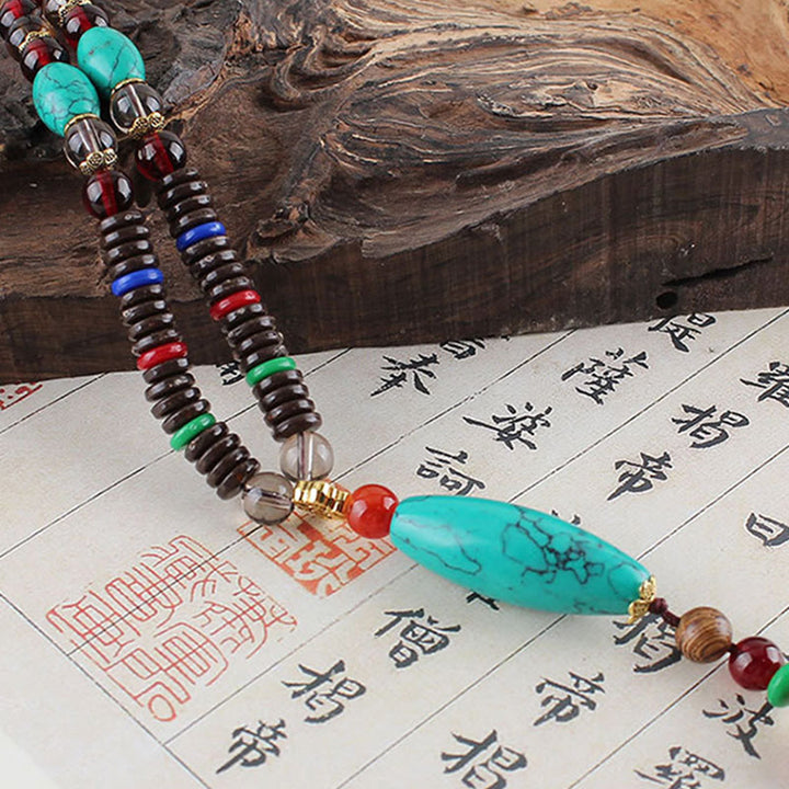 Buddha Stones Madera de wengué Piedra turquesa Protección Calma Collar Colgante