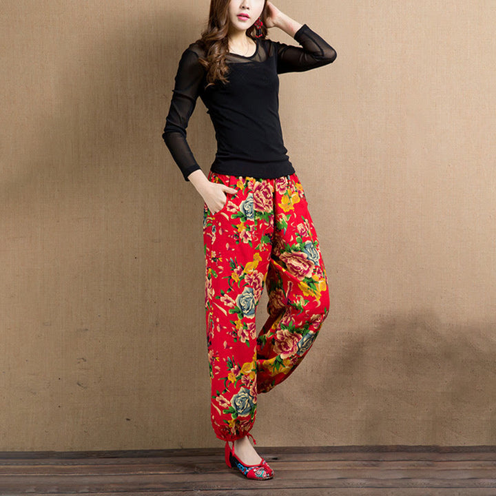 Pantalones bombachos con estampado de flores rojas y verdes de estilo étnico con Buddha Stones y bolsillos