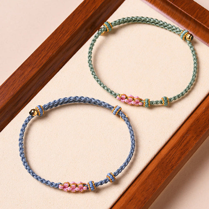 Pulsera de cuerda trenzada con protección de flor de melocotón hecha a mano con Buddha Stones