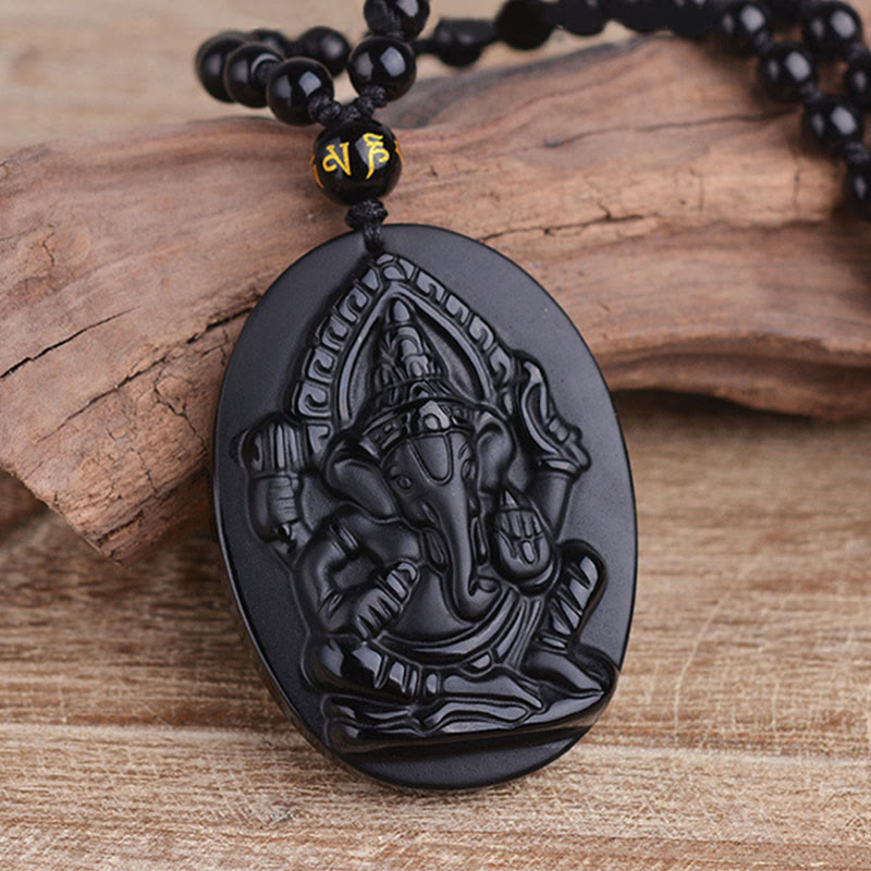 Collar con amuleto de riqueza de elefante Ganesh Ganpati de obsidiana tibetana con Buddha Stones