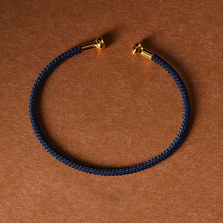 Pulsera de cuerda trenzada de la suerte hecha a mano con diseño simple de Buddha Stones