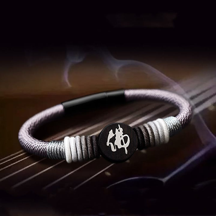 Pulsera de cuerda hecha a mano de ébano con personaje de Buda de Buddha Stones