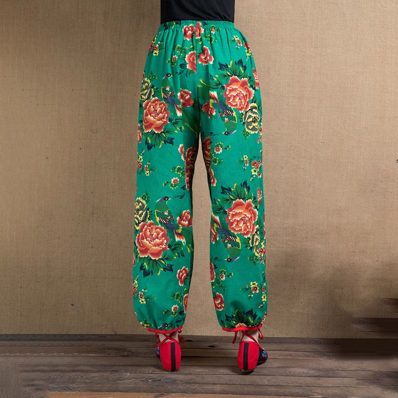 Pantalones bombachos con estampado de flores rojas y verdes de estilo étnico con Buddha Stones y bolsillos