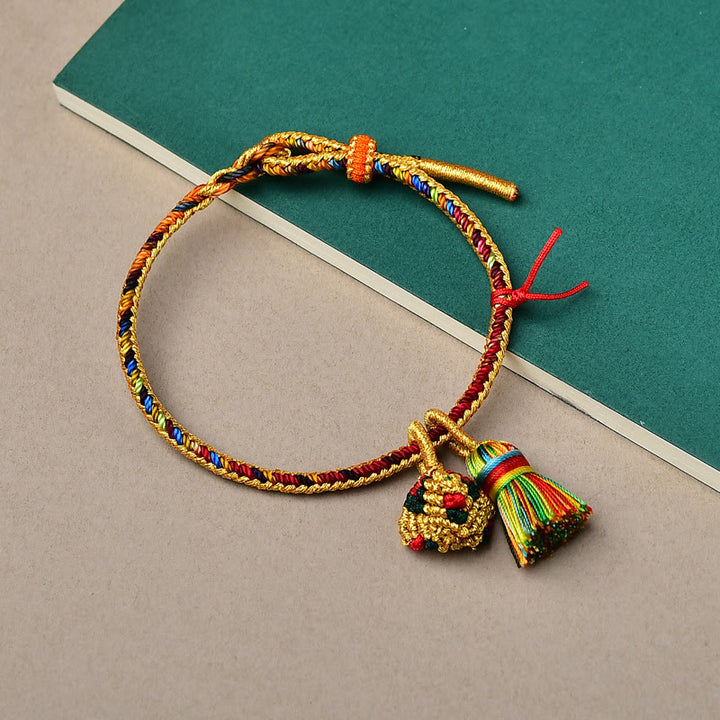 Pulsera con dije de bola dorada Zongzi hecha a mano con cuerda colorida y Buddha Stones