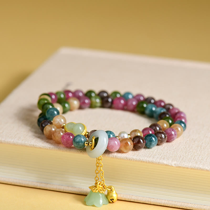 Pulsera con dije de lirio de los valles de doble envoltura de sabiduría de calabaza de turmalina multicolor con Buddha Stones