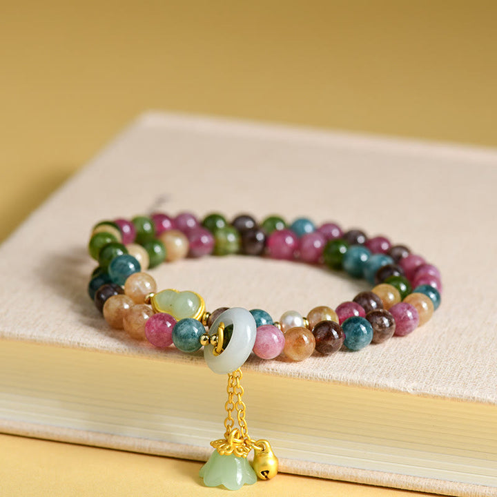 Pulsera con dije de lirio de los valles de doble envoltura de sabiduría de calabaza de turmalina multicolor con Buddha Stones