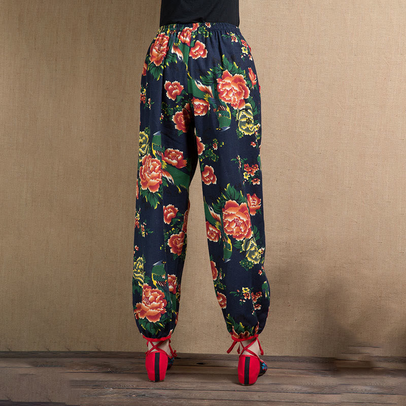 Pantalones bombachos con estampado de flores rojas y verdes de estilo étnico con Buddha Stones y bolsillos
