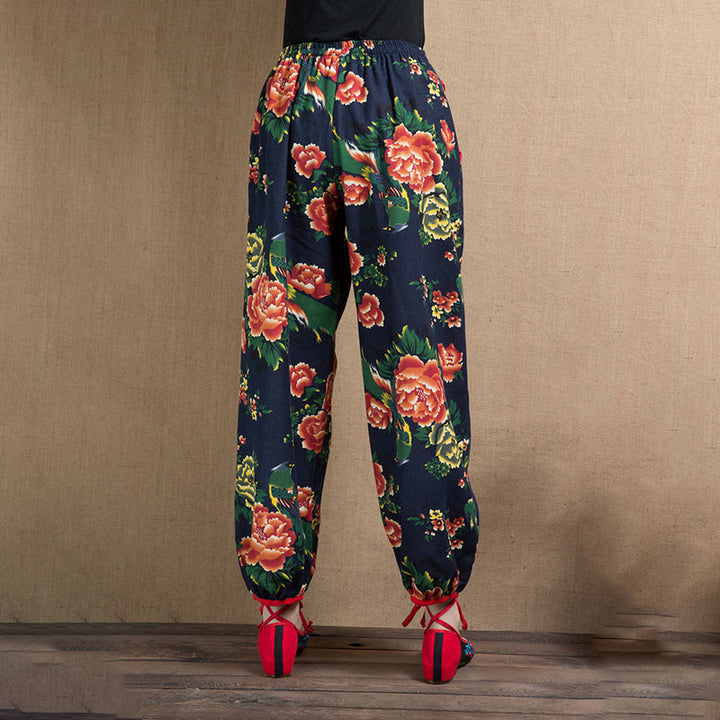 Pantalones bombachos con estampado de flores rojas y verdes de estilo étnico con Buddha Stones y bolsillos
