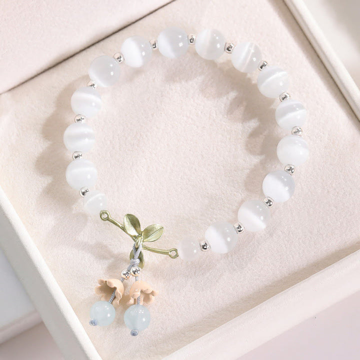 Pulsera con dije de orquídea de la paz, cristal rosa, calcedonia azul, aventurina verde, ojo de gato , Buddha Stones