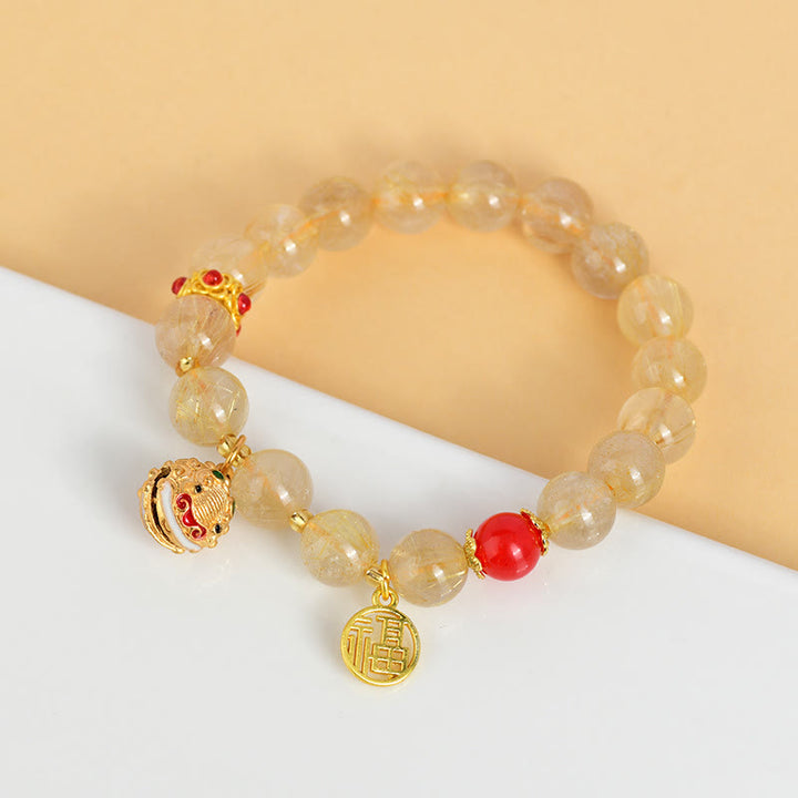 Pulsera de riqueza de campana con dije de personaje Fu de cuarzo rutilado dorado natural con Buddha Stones
