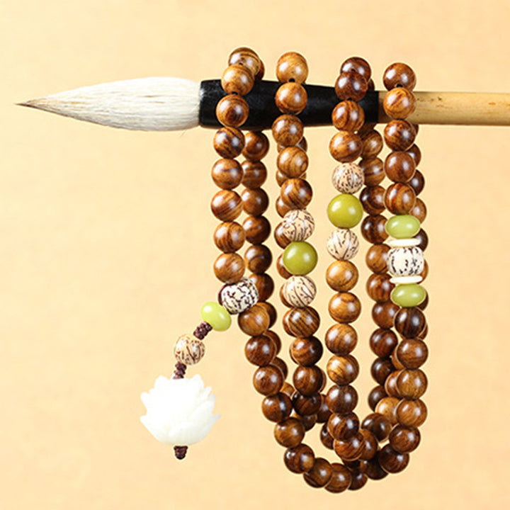 Buddha Stones Palo de rosa tibetano Loto Mala Protección Calma Collar Pulsera