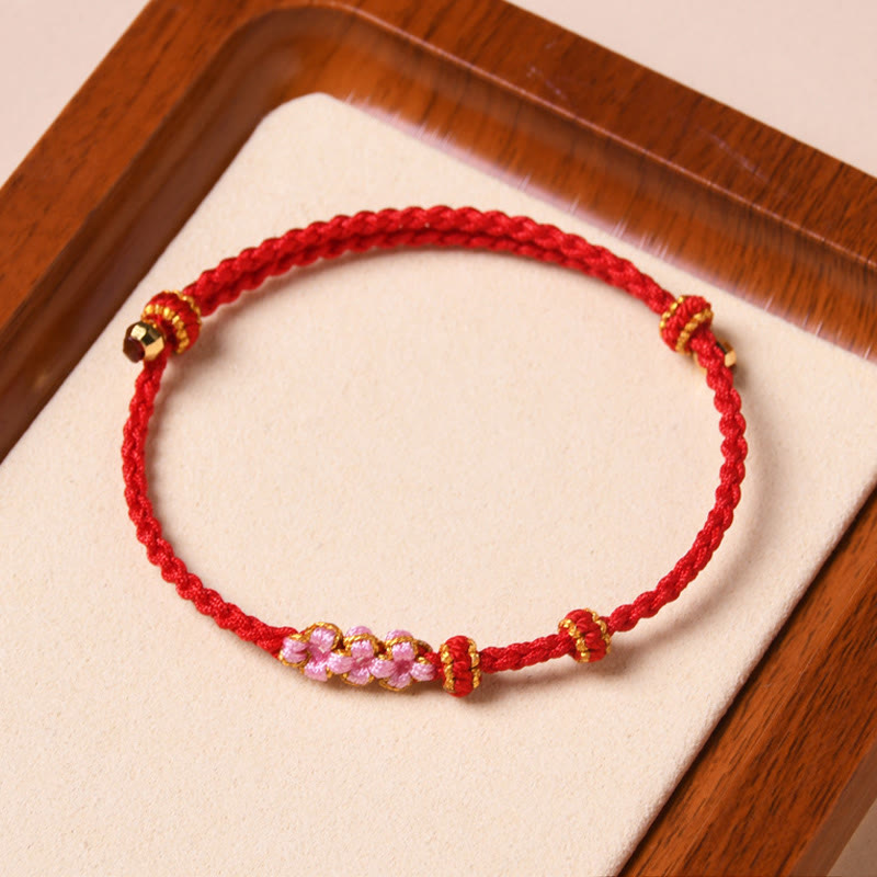 Pulsera de cuerda trenzada con protección de flor de melocotón hecha a mano con Buddha Stones