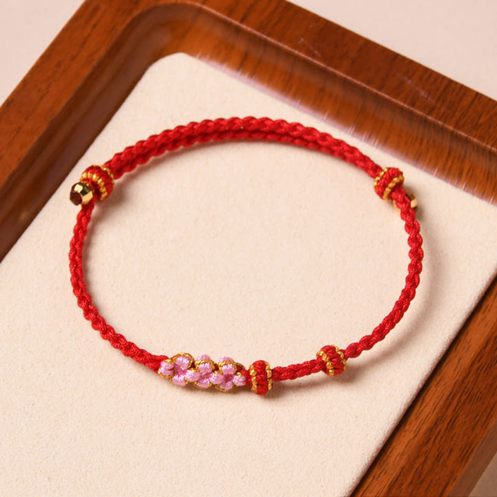 Pulsera de cuerda trenzada con protección de flor de melocotón hecha a mano con Buddha Stones