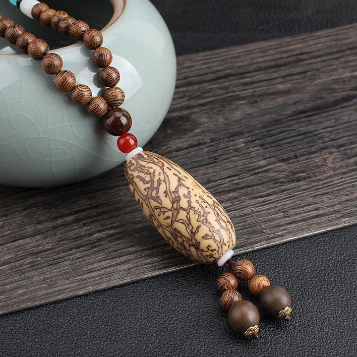 Buddha Stones, colgante de collar de paz de equilibrio de ágata de semilla Bodhi de madera de wengué tibetano